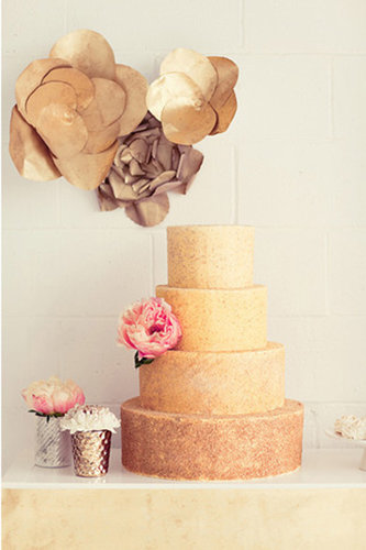 The shape of this cake is as unpretentious as it gets, but the gold color adds a striking touch.
Photo by Natalie Barrett Photography via Green Wedding Shoes
The shape of this cake is as unpretentious as it gets, but the gold color adds a striking touch.
Photo by Natalie Barrett Photography via Green Wedding Shoes