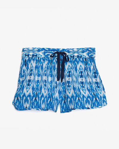 Upgrade your laid-back party look with a pair of festive printed shorts. We could see these Joie ikat-print silk shorts ($178) with a pair of metallic gladiators.
Upgrade your laid-back party look with a pair of festive printed shorts. We could see these Joie ikat-print silk shorts ($178) with a pair of metallic gladiators.