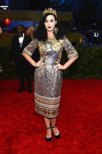 Katy Perry channeled her inner Joan of Arc in a metallic beaded Dolce & Gabbana dress, complete with a crown and cross earrings.
Katy Perry channeled her inner Joan of Arc in a metallic beaded Dolce & Gabbana dress, complete with a crown and cross earrings.