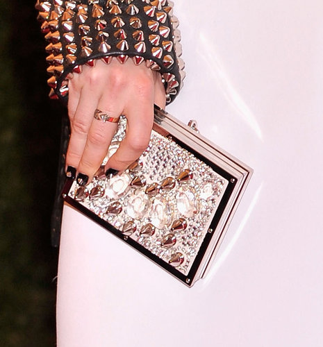 Sienna Miller carried a jeweled Burberry clutch.
Sienna Miller carried a jeweled Burberry clutch.