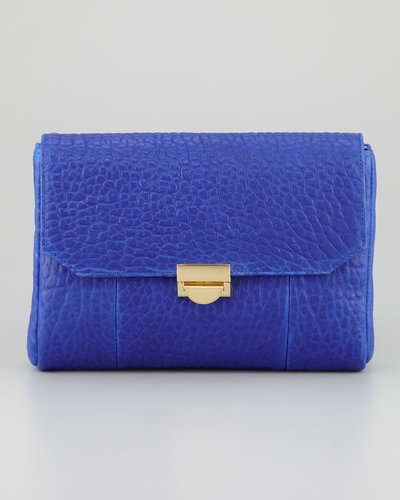 The buttery softness of pebbled leather can't be beat. The texture becomes a visual factor, too, when done in a bright hue like Lauren Merkin's day-appropriate clutch ($325).
The buttery softness of pebbled leather can't be beat. The texture becomes a visual factor, too, when done in a bright hue like Lauren Merkin's day-appropriate clutch ($325).