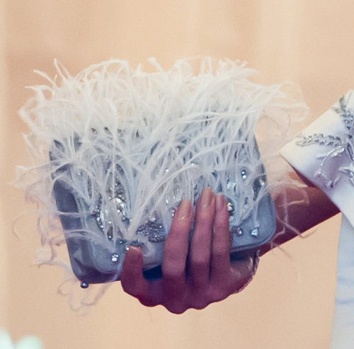 Heidi Klum toted a feathered and embellished clutch.
Heidi Klum toted a feathered and embellished clutch.