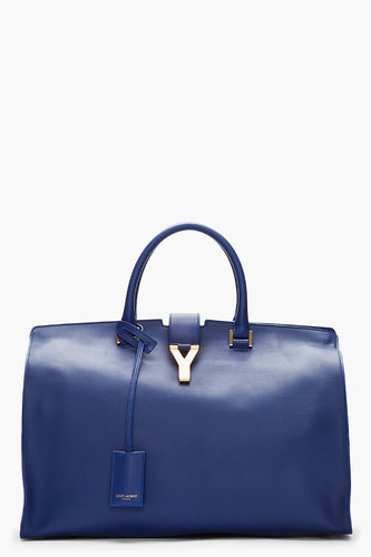 General wisdom might suggest that accessory investments be made strictly in terms of black or nude, but we beg to differ. An eternally gorgeous silhouette like Saint Laurent's leather tote ($2,950) feels even more luxurious in an inky navy.
General wisdom might suggest that accessory investments be made strictly in terms of black or nude, but we beg to differ. An eternally gorgeous silhouette like Saint Laurent's leather tote ($2,950) feels even more luxurious in an inky navy.