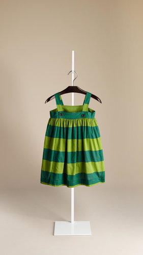 Wide stripes and bright colors make this Burberry sundress ($215) a playful addition to her wardrobe.
Wide stripes and bright colors make this Burberry sundress ($215) a playful addition to her wardrobe.