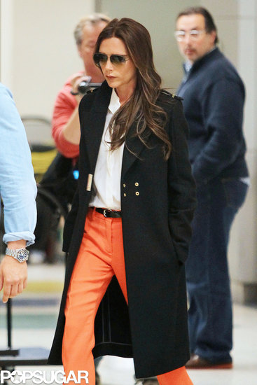 Victoria Beckham strutted her stuff in orange pants.
Victoria Beckham strutted her stuff in orange pants.