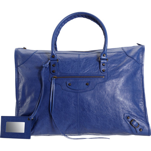 Balenciaga's blue leather weekender bag ($1,845) goes from business trip to weekend reprieve. It's a statement travel bag if we've ever seen one.
Balenciaga's blue leather weekender bag ($1,845) goes from business trip to weekend reprieve. It's a statement travel bag if we've ever seen one.