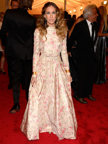 For the 2012 Met Gala, Sarah Jessica Parker chose a long-sleeved floral Valentino gown complete with matching pointy-toe pumps. Her gold cuffs, on both wrists, and silver drop earrings lent a touch of edge.
For the 2012 Met Gala, Sarah Jessica Parker chose a long-sleeved floral Valentino gown complete with matching pointy-toe pumps. Her gold cuffs, on both wrists, and silver drop earrings lent a touch of edge.