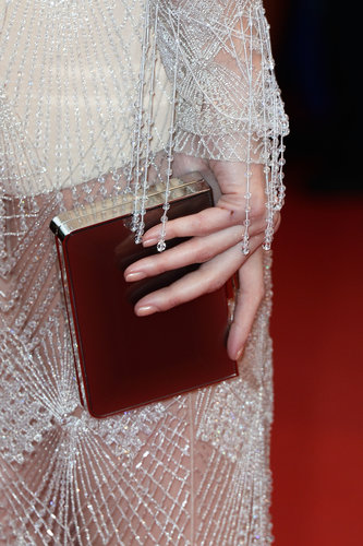 Paz Vega complemented her silver gown with a sleek box clutch.
Paz Vega complemented her silver gown with a sleek box clutch.