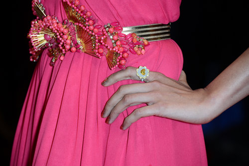 Freida Pinto belted her gown with an intricate gold-and-pink jeweled belt and a Chopard diamond ring.
Freida Pinto belted her gown with an intricate gold-and-pink jeweled belt and a Chopard diamond ring.