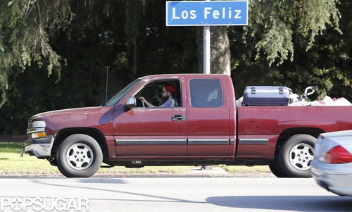 Robert Pattinson wore a red hat.
Robert Pattinson wore a red hat.