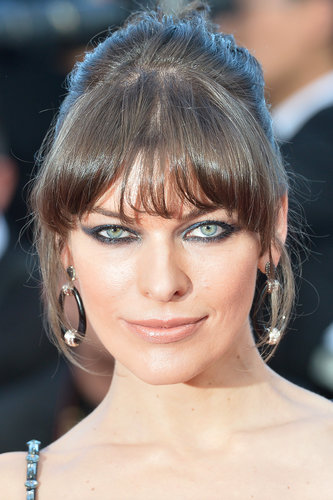 Milla Jovovich outfitted her evening gown with oversize hoop earrings.
Milla Jovovich outfitted her evening gown with oversize hoop earrings.