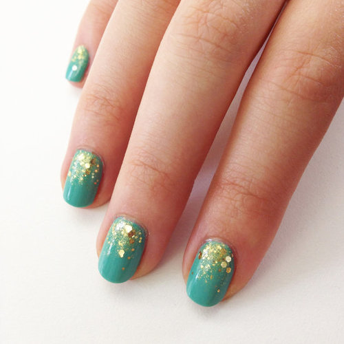 A gold glitter gradient is the perfect accent to a teal polish hue.
A gold glitter gradient is the perfect accent to a teal polish hue.
