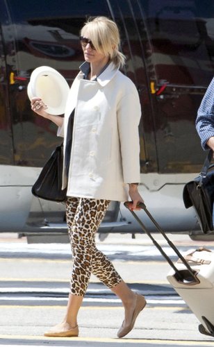 Chances are Cameron Diaz's leopard-print pants and sleek white coat are a lot cooler than your usual airplane look, but they're just as easy to throw together and just as comfy when you finish off the look with flats and a sharp tote like her Saint Laurent.
Chances are Cameron Diaz's leopard-print pants and sleek white coat are a lot cooler than your usual airplane look, but they're just as easy to throw together and just as comfy when you finish off the look with flats and a sharp tote like her Saint Laurent.