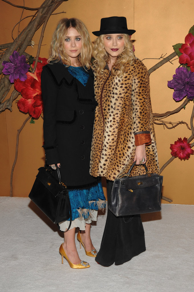 Twinning combo: The Olsens celebrated Tim Burton at a November 2009 MOMA film benefit with quirky couture styles and matching black leather satchels.
Ashley played up her faint blue streaks with a ruffled turquoise dress and mustard-colored satin pumps.
Mary-Kate channeled Tim Burton's quirky side with a leopard coat, wide-leg trousers, and a porkpie hat.
Twinning combo: The Olsens celebrated Tim Burton at a November 2009 MOMA film benefit with quirky couture styles and matching black leather satchels.
Ashley played up her faint blue streaks with a ruffled turquoise dress and mustard-colored satin pumps.
Mary-Kate channeled Tim Burton's quirky side with a leopard coat, wide-leg trousers, and a porkpie hat.