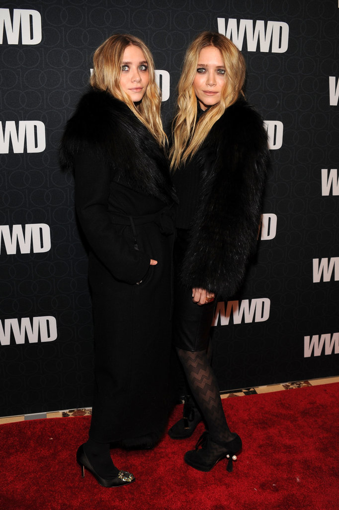Twinning combo: The sisters jazzed up their signature all-black looks with luxe fur toppers at WWD's 100 Anniversary celebration in November 2010.
Ashley was cozy-chic in a long, fur-trimmed coat and jeweled satin pumps.
Mary-Kate chose a shorter plush topper, leather skirt, and zigzag-print tights.
Twinning combo: The sisters jazzed up their signature all-black looks with luxe fur toppers at WWD's 100 Anniversary celebration in November 2010.
Ashley was cozy-chic in a long, fur-trimmed coat and jeweled satin pumps.
Mary-Kate chose a shorter plush topper, leather skirt, and zigzag-print tights.