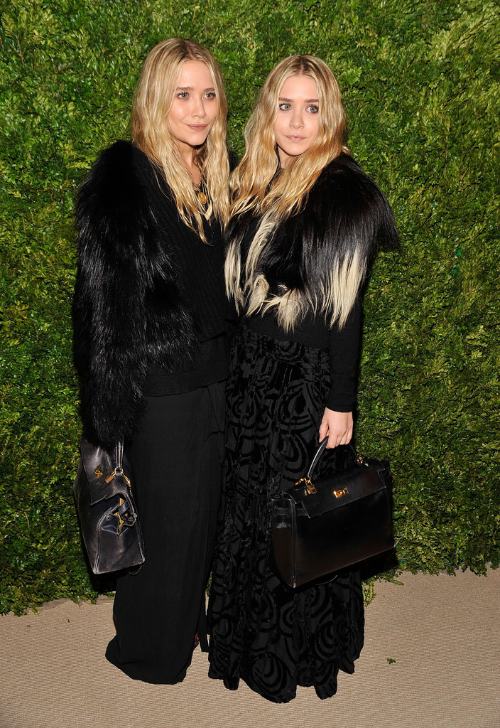 Twinning combo: Complementing furs and matching leather totes were the girls' look of choice for the CFDA/Vogue Fashion Fund Awards in 2003.
Mary-Kate fused fur, leather, and wool to create her monochromatic look.
Ashley layered a plush ombré topper over her jacquard maxi skirt.
Twinning combo: Complementing furs and matching leather totes were the girls' look of choice for the CFDA/Vogue Fashion Fund Awards in 2003.
Mary-Kate fused fur, leather, and wool to create her monochromatic look.
Ashley layered a plush ombré topper over her jacquard maxi skirt.
