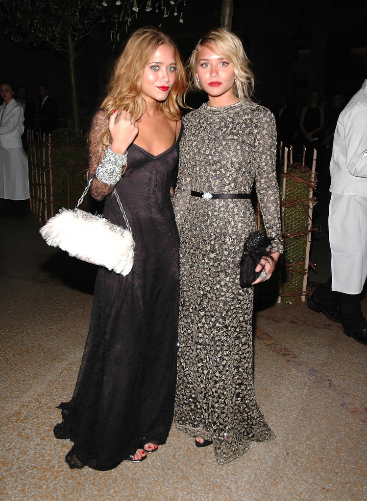 Twinning combo: The dynamic duo upped the glam factor with feathered bags and red-hot lipstick at the 2006 Met Gala.
Mary-Kate posed next to her partner in crime donning a slinky black gown by Badgley Mischka with lace sleeves and a white feathered bag.
Ashley polished off her beaded Badgley Mischka creation with a black feather clutch and diamond cluster earrings.
Twinning combo: The dynamic duo upped the glam factor with feathered bags and red-hot lipstick at the 2006 Met Gala.
Mary-Kate posed next to her partner in crime donning a slinky black gown by Badgley Mischka with lace sleeves and a white feathered bag.
Ashley polished off her beaded Badgley Mischka creation with a black feather clutch and diamond cluster earrings.