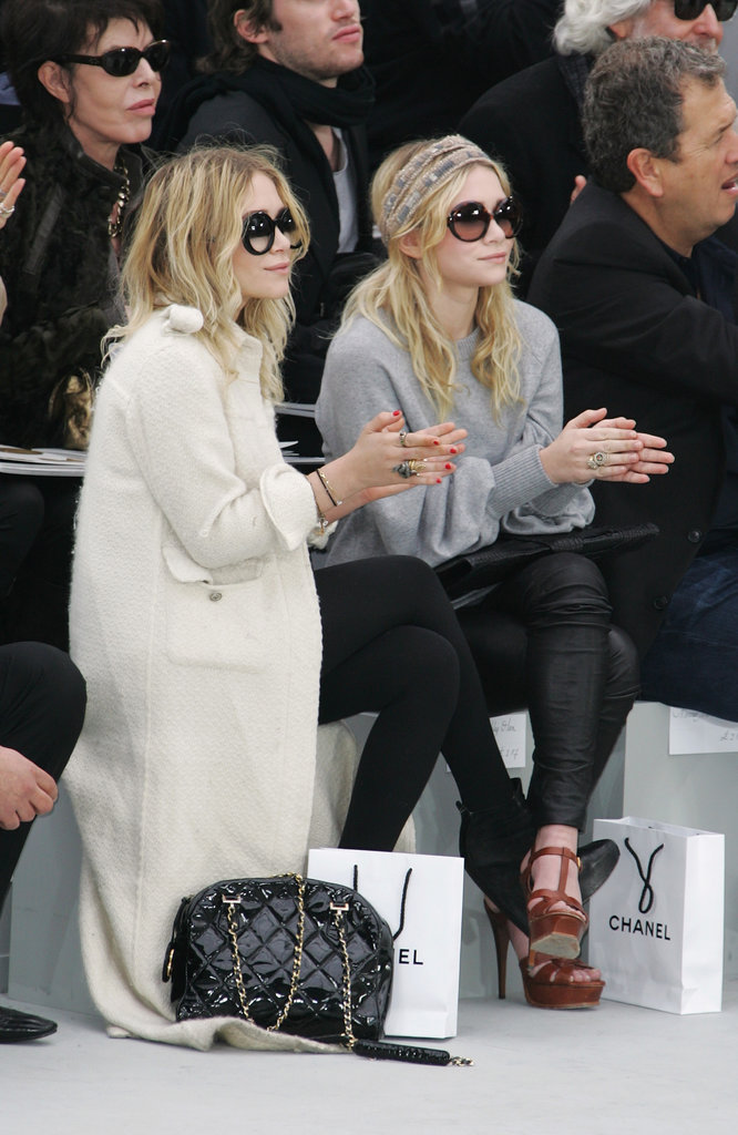 Twinning combo: The girls took in the Chanel Fall/Winter 2008 show with killer eyewear.
Ashley paired a long, white tweed coat with black ankle boots, a quilted bag, and oversize shades.
Mary-Kate went sporty in a gray sweater, black leather leggings, and YSL platforms and a printed headscarf.
Twinning combo: The girls took in the Chanel Fall/Winter 2008 show with killer eyewear.
Ashley paired a long, white tweed coat with black ankle boots, a quilted bag, and oversize shades.
Mary-Kate went sporty in a gray sweater, black leather leggings, and YSL platforms and a printed headscarf.