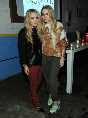Twinning combo: The twins put their cool-girl spin on cargo pants at a Textile Elizabeth and James celebration in 2011.
Mary-Kate opted for a Fall-friendly palette wearing a black crocodile sweater with rust-hued pants and pointed pumps.
Ashley went cheeky in a fox-print sweater, cuffed army-green pants, and futuristic mint Mary Janes.
Twinning combo: The twins put their cool-girl spin on cargo pants at a Textile Elizabeth and James celebration in 2011.
Mary-Kate opted for a Fall-friendly palette wearing a black crocodile sweater with rust-hued pants and pointed pumps.
Ashley went cheeky in a fox-print sweater, cuffed army-green pants, and futuristic mint Mary Janes.