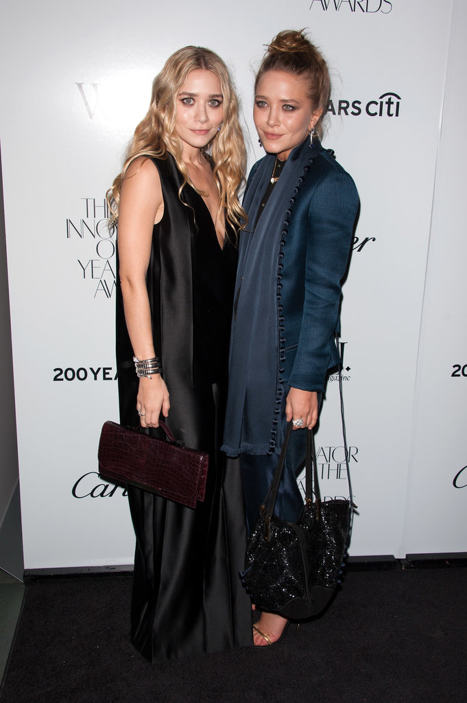 Twinning combo: In October 2012, the Olsen sisters hit the WSJ Magazine's Innovator of the Year Awards in moody hues, both by The Row.
Ashley worked a silky black V-neck dress with pleated panels, while toting all her party essentials in a burgundy bag by The Row.
Mary-Kate beat the Winter blues in a sleek navy suit of tapered pants and a tailored blazer featuring a soft waterfall detail.
Twinning combo: In October 2012, the Olsen sisters hit the WSJ Magazine's Innovator of the Year Awards in moody hues, both by The Row.
Ashley worked a silky black V-neck dress with pleated panels, while toting all her party essentials in a burgundy bag by The Row.
Mary-Kate beat the Winter blues in a sleek navy suit of tapered pants and a tailored blazer featuring a soft waterfall detail.