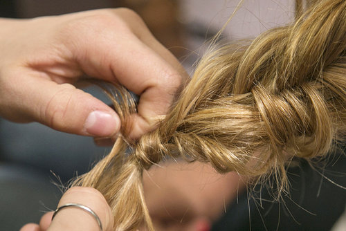 If you want to get a little fancy, before you completely secure the elastic, wrap a section of hair around the elastic before pulling the hair through the final loop of the band.
If you want to get a little fancy, before you completely secure the elastic, wrap a section of hair around the elastic before pulling the hair through the final loop of the band.