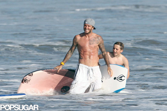 David Beckham showed off his washboard abs when he went boogie boarding with son Brooklyn in Malibu back in August 2011.
David Beckham showed off his washboard abs when he went boogie boarding with son Brooklyn in Malibu back in August 2011.