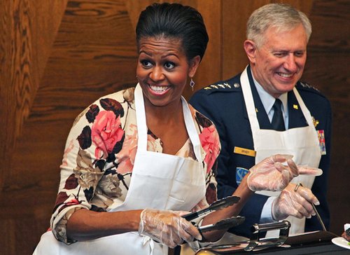 In November 2010, First Lady Michelle Obama joked around while serving meals to US soldiers at a US military airbase in Southwest Germany.
In November 2010, First Lady Michelle Obama joked around while serving meals to US soldiers at a US military airbase in Southwest Germany.