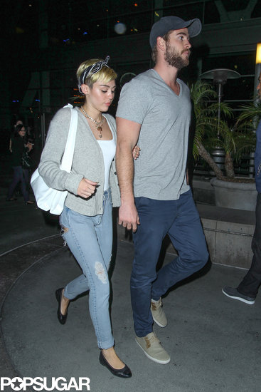 Miley Cyrus held on to her fiancé, Liam Hemsworth, for a movie date in LA. Miley Cyrus held on to her fiancé, Liam Hemsworth, for a movie date in LA.
