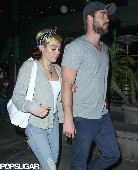 Miley Cyrus held her fiancé Liam Hemsworth's arm while out in LA.
Miley Cyrus held her fiancé Liam Hemsworth's arm while out in LA.