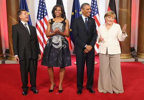 For her latest European appearance, a dinner at the Charlottenburg Palace in Berlin, Michelle Obama looked undeniably fabulous in a printed fit-and-flare dress — we especially adore the bow detail.
For her latest European appearance, a dinner at the Charlottenburg Palace in Berlin, Michelle Obama looked undeniably fabulous in a printed fit-and-flare dress — we especially adore the bow detail.