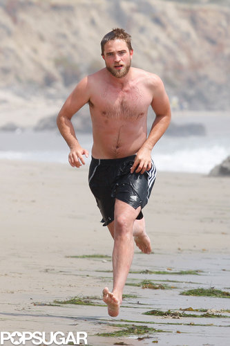 Robert Pattinson and his muscles hit the sand in Malibu in March 2012.
Robert Pattinson and his muscles hit the sand in Malibu in March 2012.