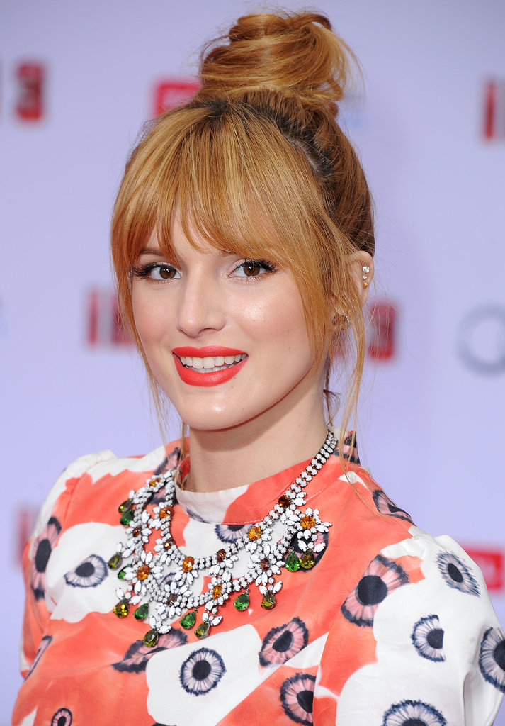 A fiery orange lip hue, just like Bella Thorne's, is the ideal complement to a twisted topknot. Both make a statement and are right on trend for Summer 2013.
A fiery orange lip hue, just like Bella Thorne's, is the ideal complement to a twisted topknot. Both make a statement and are right on trend for Summer 2013.
