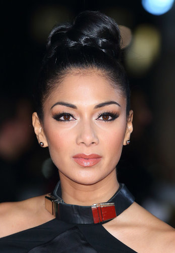 Just like you often see hair wrapped around the elastic of a ponytail, you can create a similar style with a topknot. Nicole Scherzinger accented hers with a braid.
Just like you often see hair wrapped around the elastic of a ponytail, you can create a similar style with a topknot. Nicole Scherzinger accented hers with a braid.