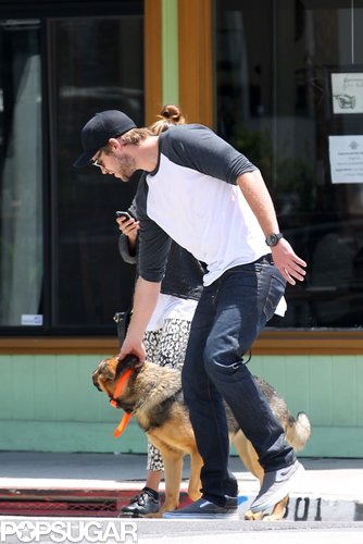 Liam Hemsworth bent down to show a furry friend some love in LA in May 2012.
Liam Hemsworth bent down to show a furry friend some love in LA in May 2012.