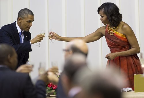 President Obama and First Lady Michelle clinked their glasses together while visiting Pretoria, South Africa, in June.
President Obama and First Lady Michelle clinked their glasses together while visiting Pretoria, South Africa, in June.