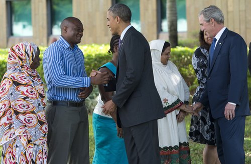 In July, President Obama and former President George W. Bush greeted the family members of victims of the 1998 US Embassy bombing in Dar es Salaam, Tanzania.
In July, President Obama and former President George W. Bush greeted the family members of victims of the 1998 US Embassy bombing in Dar es Salaam, Tanzania.