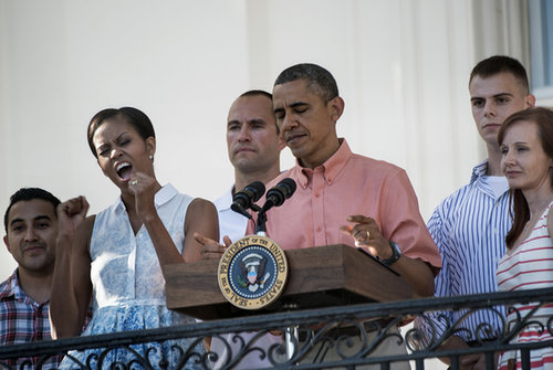 Michelle Obama cheered while President Obama addressed members of the military and their families at the 2013 White House BBQ.
Michelle Obama cheered while President Obama addressed members of the military and their families at the 2013 White House BBQ.