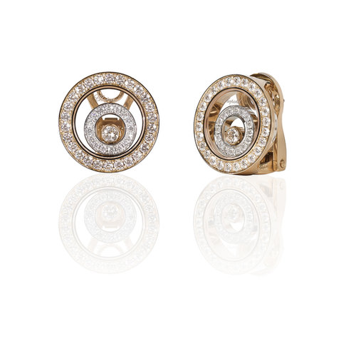 Chopard Happy Spirit collection earrings, featuring floating diamonds in an 18-karat white and 18-karat yellow gold earring.
Source: Chopard
Chopard Happy Spirit collection earrings, featuring floating diamonds in an 18-karat white and 18-karat yellow gold earring.
Source: Chopard