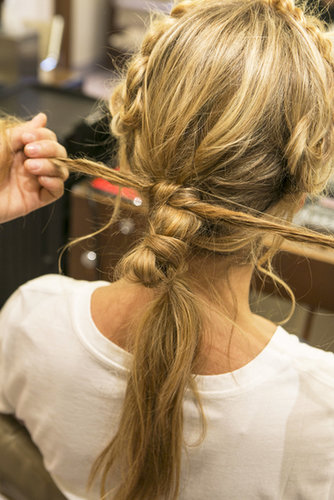Tie the two ends into a knot around the top of the ponytail base.
Tie the two ends into a knot around the top of the ponytail base.