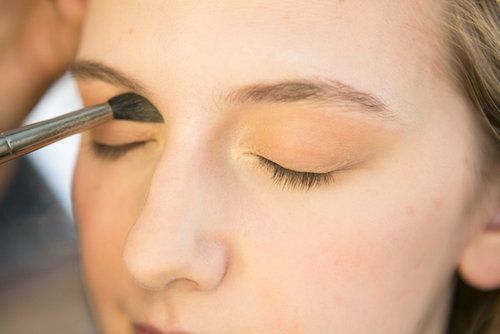 To brighten up the soft brown all over the lids, Bettelli went back with a shimmering gold shadow, which she dusted into the inner corners of the eyes.
To brighten up the soft brown all over the lids, Bettelli went back with a shimmering gold shadow, which she dusted into the inner corners of the eyes.