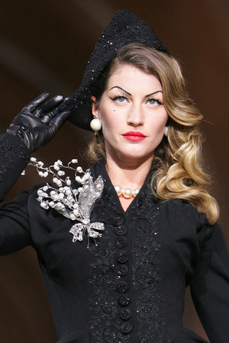 With arched brows, red lips, and a penciled-in beauty mark, Gisele commanded the runway at Dior's 60th anniversary show in Paris.
With arched brows, red lips, and a penciled-in beauty mark, Gisele commanded the runway at Dior's 60th anniversary show in Paris.