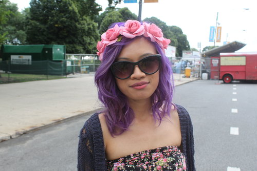 Purple hair and a crown of pink roses made Jennie the poster child for all things festival beauty.
Purple hair and a crown of pink roses made Jennie the poster child for all things festival beauty.