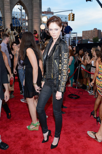 Coco Rocha took her look to rocker heights in a black embellished leather Fausto Puglisi biker jacket and slim black jeans.
Coco Rocha took her look to rocker heights in a black embellished leather Fausto Puglisi biker jacket and slim black jeans.