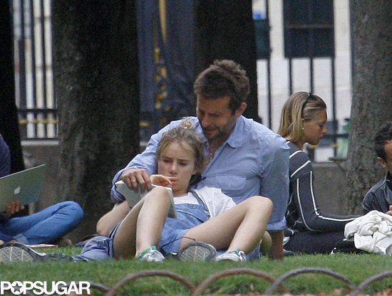 Bradley Cooper and Suki Waterhouse read together at a Paris park.
Bradley Cooper and Suki Waterhouse read together at a Paris park.