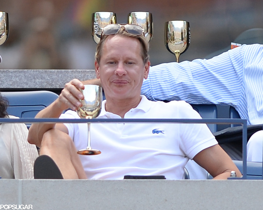 Carson Kressley sipped a beverage from a silver cup.
Carson Kressley sipped a beverage from a silver cup.
