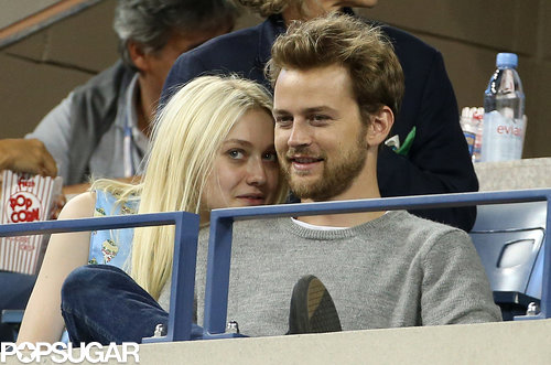 Dakota Fanning cozied up to her boyfriend, Jamie Strachan, during the match.
Dakota Fanning cozied up to her boyfriend, Jamie Strachan, during the match.