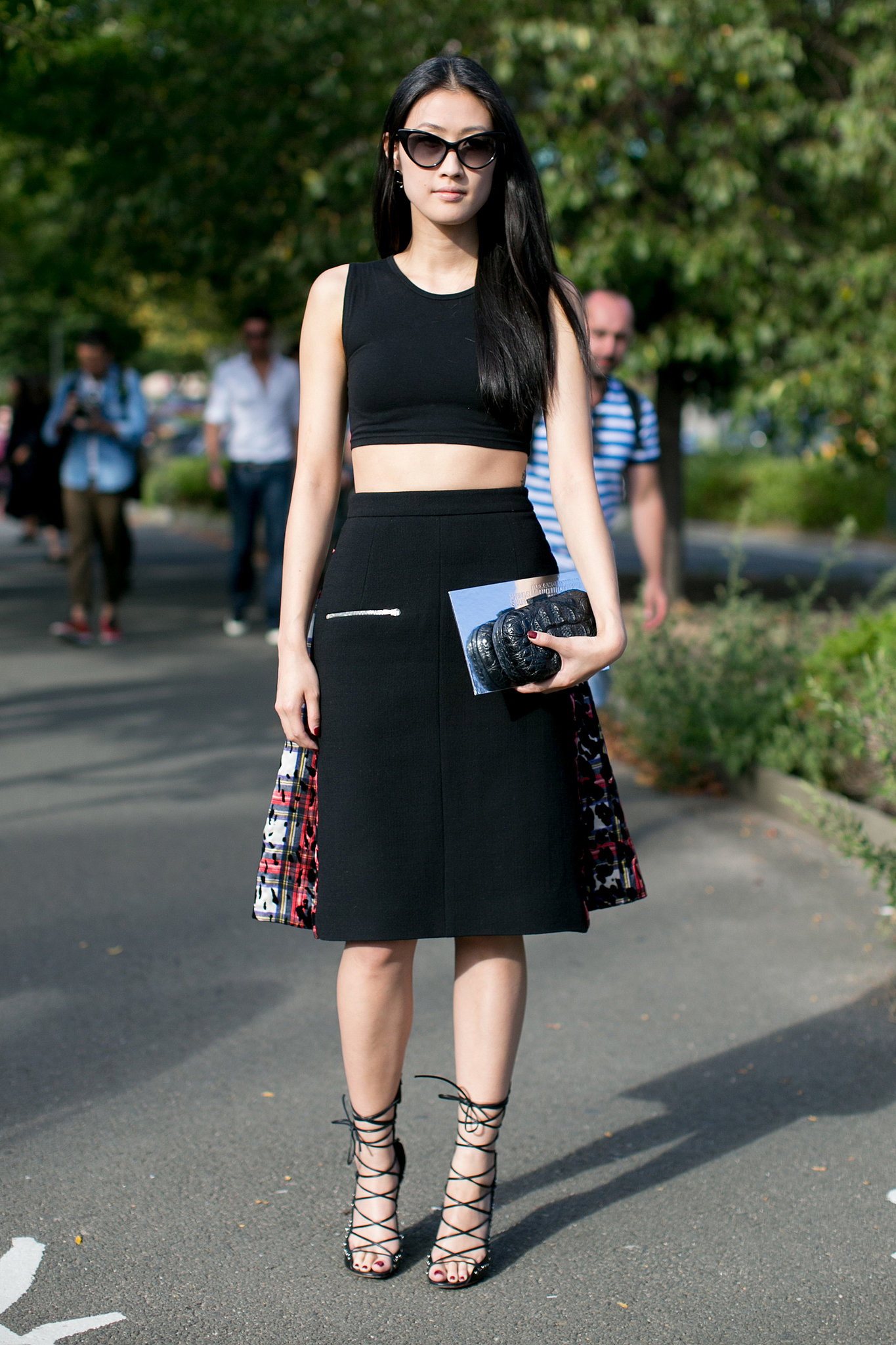 She got the memo on crop tops and lace-up heels, adding both to her Preen by Thornton Bregazzi skirt.
