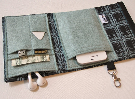 Transferring all your necessary gizmos from one bag to another (and in and out of your desk) can be a real hassle. The Nerd Herder Gadget Wallet ($29) adds some pizzazz with pixelated plaid while securing your cell phone, USB drive, SD card, office key card, earbuds, and more.
Transferring all your necessary gizmos from one bag to another (and in and out of your desk) can be a real hassle. The Nerd Herder Gadget Wallet ($29) adds some pizzazz with pixelated plaid while securing your cell phone, USB drive, SD card, office key card, earbuds, and more.
