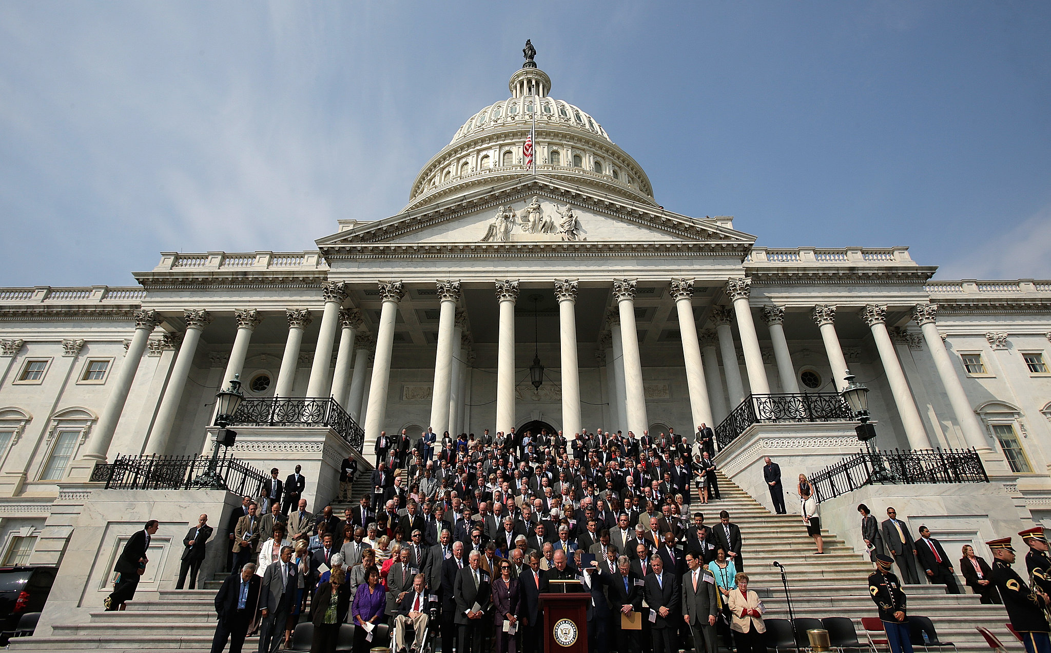 Members of Congress observed a moment of silence on the steps of the