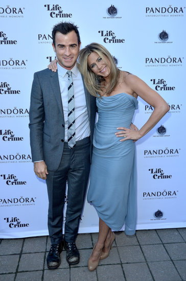 Jennifer Aniston and Justin Theroux posed together at a cocktail party in Toronto.
Jennifer Aniston and Justin Theroux posed together at a cocktail party in Toronto.